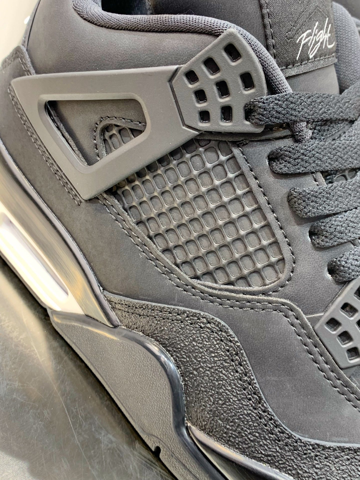 Air Jordan 4 Grey / White detail view 1